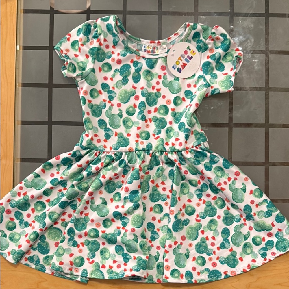 NWT. DotDotSmile dress. Size 12/24M.